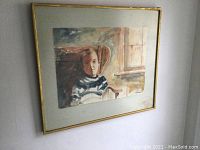 Framed watercolour painting viewed from an angle showing full artwork and matting.