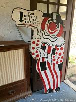 Full frontal view of the wooden clown cutout sign showing overall design and condition.