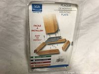 Packaged mounting plate kit with screws and finishing trims labeled for easy installation, showing packaging and product illustration.