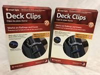 Two boxes of Smart Light Deck Clips photographed side by side showing the front packaging.