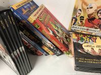 Photo showing multiple DVD cases including 'Avatar The Last Airbender Book 2 Earth Volume 3', 'The Simpsons Movie', 'Shrek the Third', 'Deadliest Catch' and 'Beach Party'.