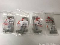 Set of four metal pulls in original clear plastic packaging with Richelieu label and barcode visible.