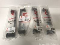 Four brand new Richelieu metal pulls in original packaging.