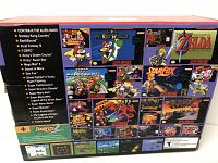Back of the box showing the list of 21 preloaded classic SNES games including titles such as Contra III, Donkey Kong Country, Final Fantasy III, The Legend of Zelda, Star Fox and more.