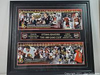 Full view of the framed memorabilia with images and timelines of Daniel Alfredsson and Chris Phillips.