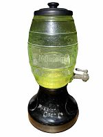Full frontal view of green glass barrel atop black base with spigot