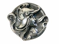 Front view of round repousse pin showing maiden in horned helmet