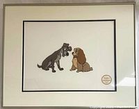 Framed serigraph showing Lady and Tramp characters with Walt Disney Limited Edition seal.