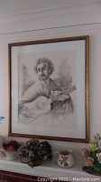 Full view of framed pen and ink drawing showing man playing guitar above mantle with floral decor