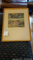 Full view of framed original watercolor painting depicting a scenic landscape by R. Thornhill.