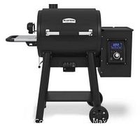 Front view of assembled pellet grill showing barrel, legs, front shelf and digital control panel