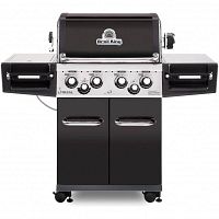 Front view of assembled grill with closed lid showing control panel and side shelves