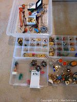 Top view of mixed necklaces, bracelets, and compartment organizers with earrings and rings