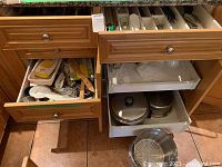 Five open drawers showing contents