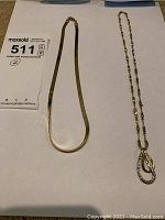 Two necklaces side by side on white background
