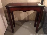Full view of wood stand or occasional table with East Asian design
