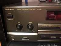 Front panel showing Technics branding, model SU-G75, power switch, bass and treble knobs, headphone jack, and speaker selector.