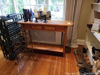 Full view of solid pine wood console table showing one drawer, bottom shelf, wooden knob, and natural wood grain finish.