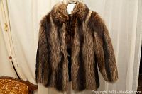 Front view of vintage raccoon fur jacket showing fur texture and collar.