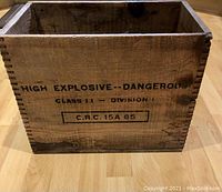 Front and side view of vintage wood crate showing warning text and condition