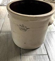 Front view of the No. 3 Crown crock, showing the beige exterior and crown emblem.