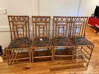 Front view of all four bamboo chairs lined up