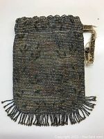 Front view of the Victorian small beaded purse showing intricate dark-toned beadwork and the pull strap.