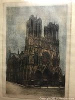 Close up of the etching showing Rheims Cathedral in dark gothic style with blue sky.