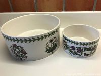 Two round ceramic bowls side by side with decorative botanical print from the Botanic Garden series by Susan Williams-Ellis for Portmeirion.