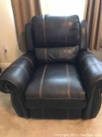 Front view of recliner in upright position showing overall design and condition