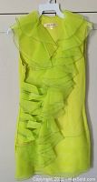 Front view of lightweight sleeveless ruffled ladies dress in bright chartreuse yellow-green