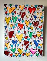 Frontal view of full canvas showing multicolored heart motif with white drips