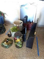 Wide view of lot showing Goose Island chalk board, ceramic crocks, red spice drawers, candle holders, wooden shelf, and other small wooden items on floor.