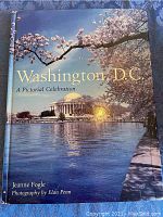 Cover photo of the book Washington, D.C. A Pictorial Celebration showing cherry blossoms and the Jefferson Memorial reflecting in water