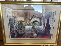 Full view of the large framed picture showing the solarium veranda scene with plants, statues, art, and decorative objects.