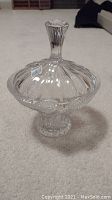 Full view of the crystal dish with lid, showing shape, size, and decorative pattern.