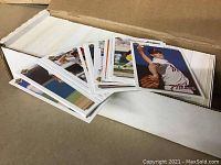 Photo of a cardboard box with over 600 Upper Deck baseball cards mostly in good condition, showing player images and the Upper Deck logo.