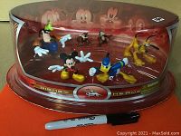 Front view of sealed Disney Heroes box set with six character figurines visible inside.