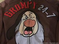 Close-up photo of front showing Grumpy character graphic and "GRUMPY 24-7" text