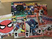 Photo showing all seven Web of Spider-Man comics in a fanned layout, highlighting front covers with various Spider-Man themed illustrations.