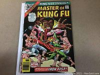 Front cover of the 1976 Master of Kung Fu Annual #1 comic book showing the title and artwork with Shang-Chi fighting Iron Fist.