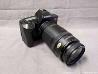 Canon EOS 620 with 70-210mm zoom lens angled from front left showing lens and body