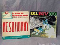 Front covers of The 2 Live Crew 'Me So Horny' and Bell Biv DeVoe 'Poison' vinyl records.