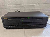 Front view of Marantz Professional PMD-300CP USB cassette player recorder showing dual cassette decks, control buttons, level meter displays, and digital counter.