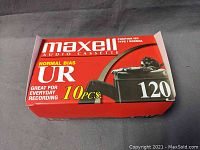 Box of 10 Maxell UR 120 audio cassette tapes, unopened and in original packaging with red and white design.