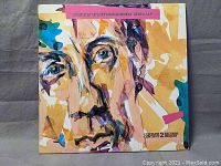 Front cover of Pete Townshend double album "Psychoderelict" showing abstract portrait in bright colors.