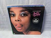 Front cover of Millie Jackson's 'Feelin' Bitchy' vinyl record album with close-up of face artwork.