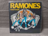 Front cover of The Ramones 'Road to Ruin' vinyl LP album with cartoon band artwork.