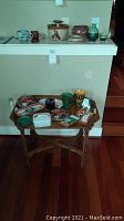 Full lot arranged on bamboo side table showing trays, cups, bowls, box