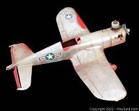 Top view of 1953 AMF Wen-Mac F4U Corsair model airplane showing wing details and engine propeller.